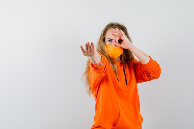 Expressive young woman posing in the studio