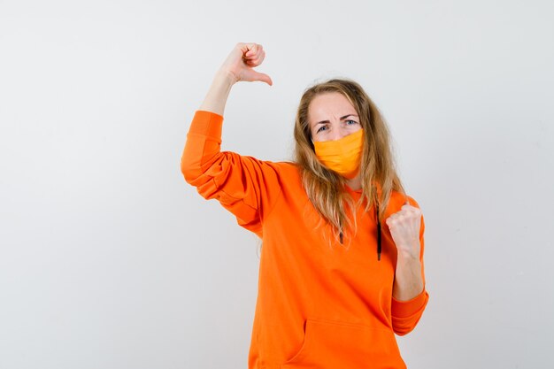 Expressive young woman posing in the studio