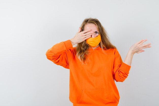 Expressive young woman posing in the studio