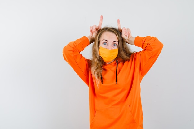 Expressive young woman posing in the studio