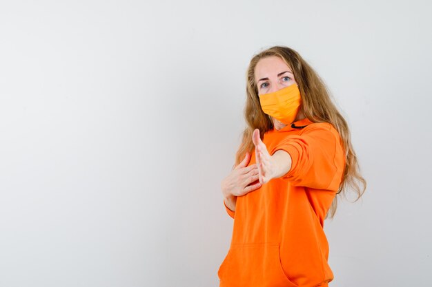 Expressive young woman posing in the studio