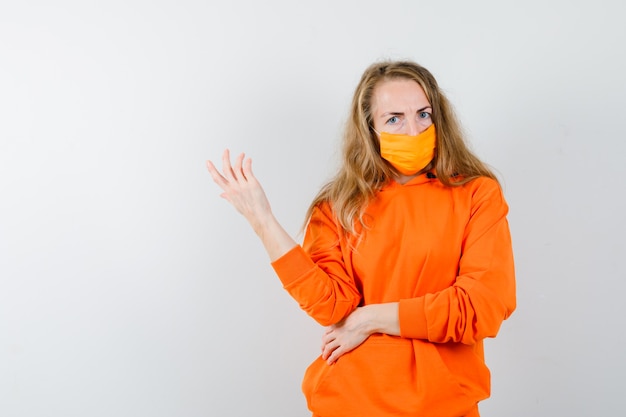 Expressive young woman posing in the studio