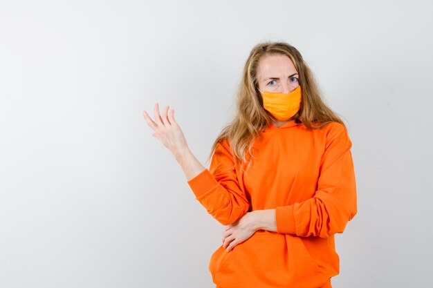 Expressive young woman posing in the studio