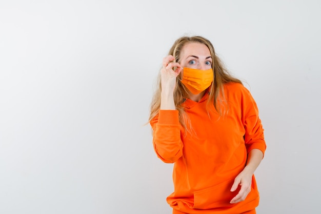 Expressive young woman posing in the studio