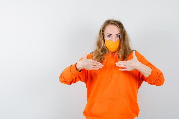 Expressive young woman posing in the studio