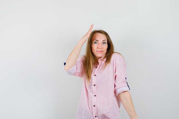 Expressive young woman posing in the studio