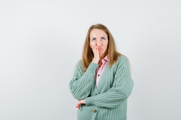 Expressive young woman posing in the studio