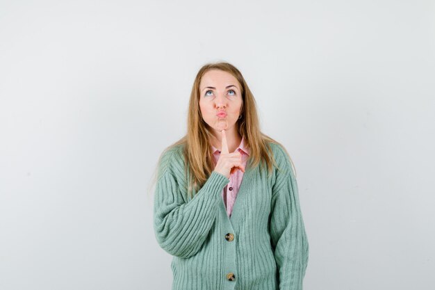 Expressive young woman posing in the studio