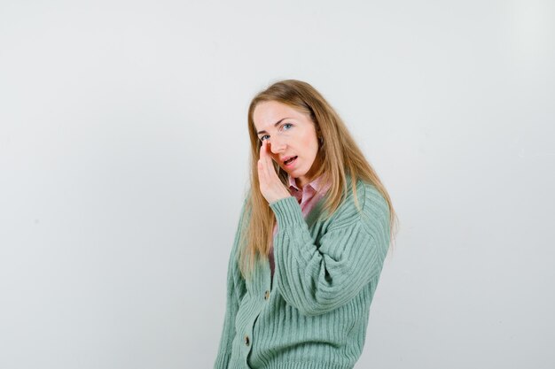 Expressive young woman posing in the studio