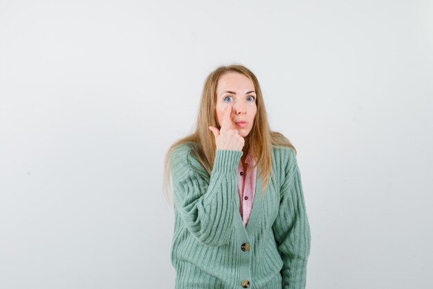 Expressive young woman posing in the studio