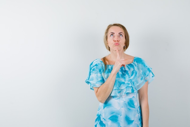 Expressive young woman posing in the studio