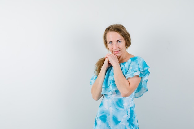 Expressive young woman posing in the studio