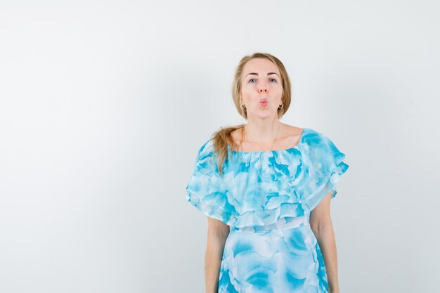 Expressive young woman posing in the studio