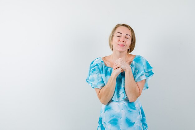 Expressive young woman posing in the studio