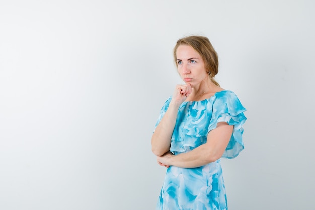 Expressive young woman posing in the studio