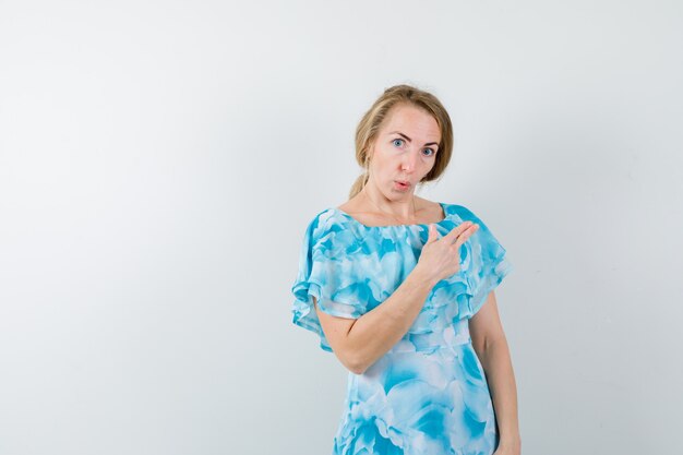 Expressive young woman posing in the studio