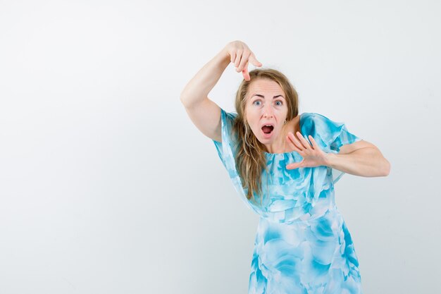 Expressive young woman posing in the studio