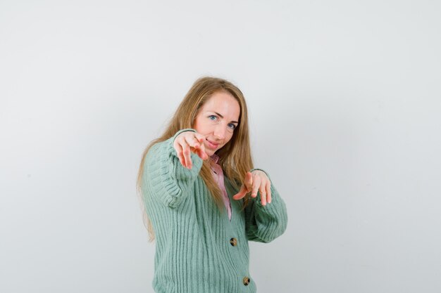 Expressive young woman posing in the studio