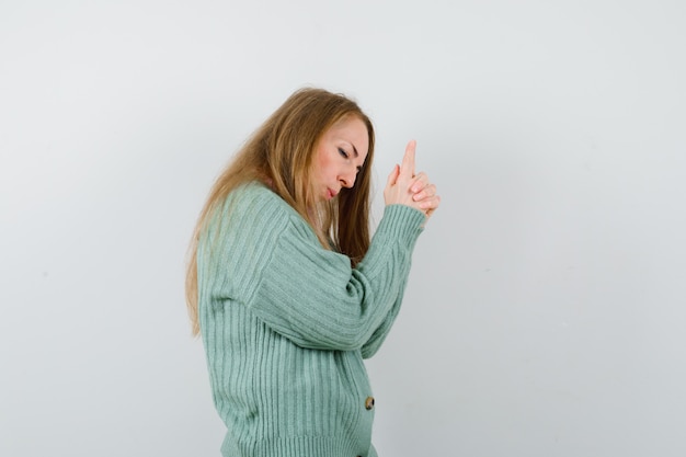 Expressive young woman posing in the studio