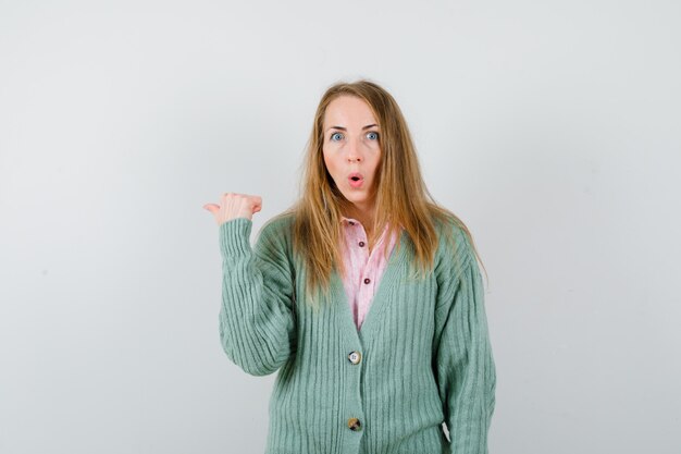 Expressive young woman posing in the studio