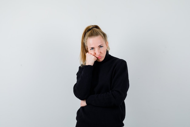 Expressive young woman posing in the studio