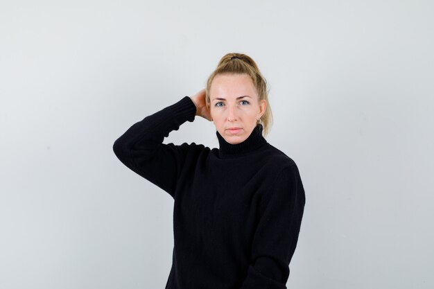 Expressive young woman posing in the studio