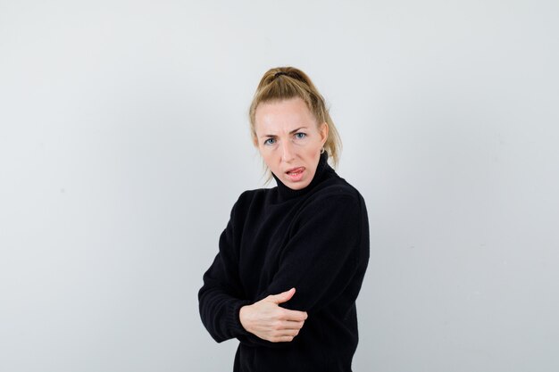 Expressive young woman posing in the studio