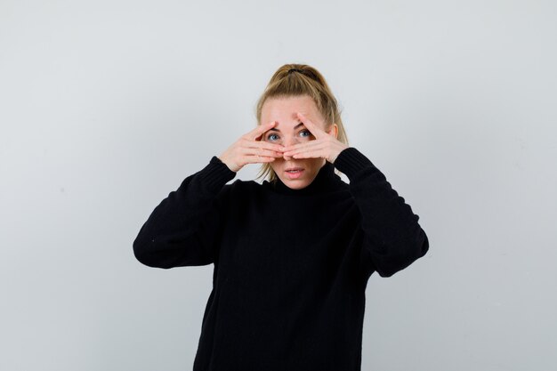 Expressive young woman posing in the studio