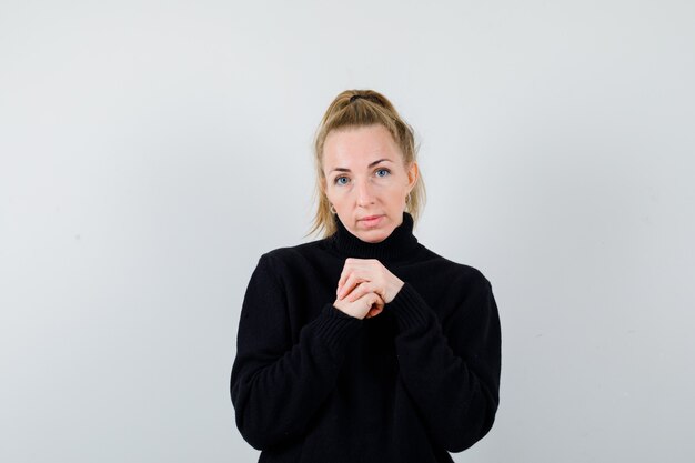 Expressive young woman posing in the studio