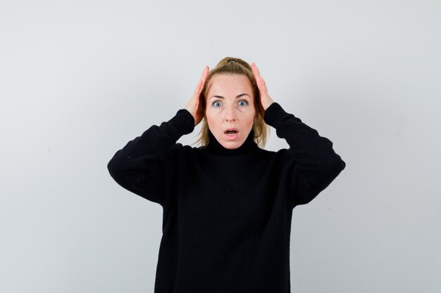 Expressive young woman posing in the studio