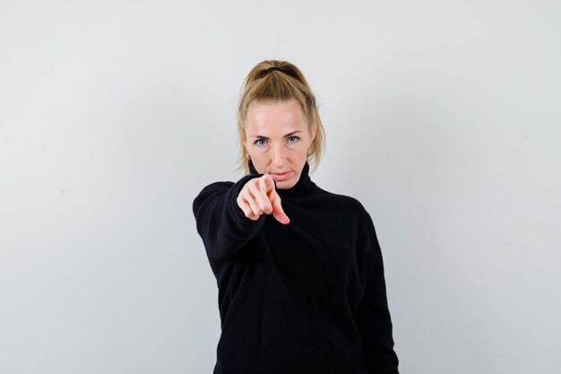 Expressive young woman posing in the studio