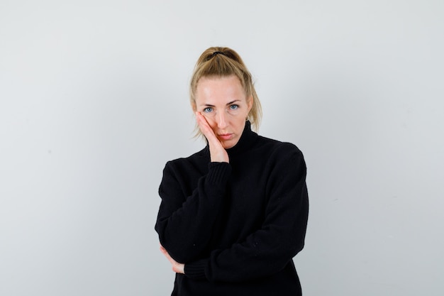 Expressive young woman posing in the studio