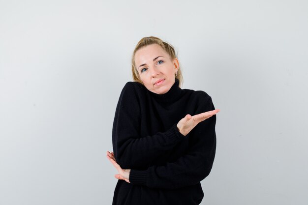 Expressive young woman posing in the studio