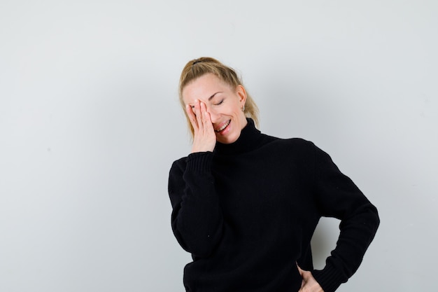 Expressive young woman posing in the studio