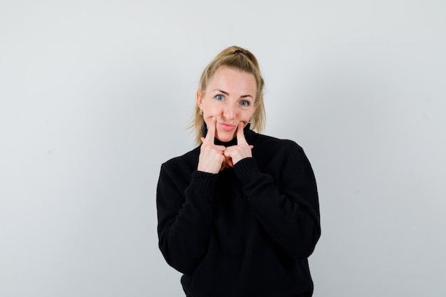 Expressive young woman posing in the studio