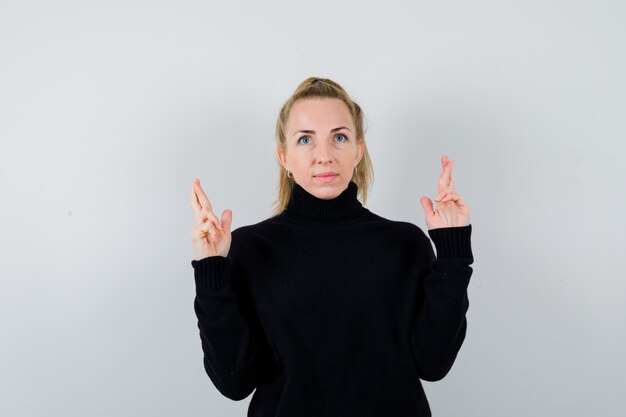 Expressive young woman posing in the studio