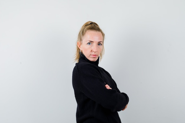 Expressive young woman posing in the studio