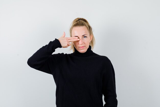 Expressive young woman posing in the studio