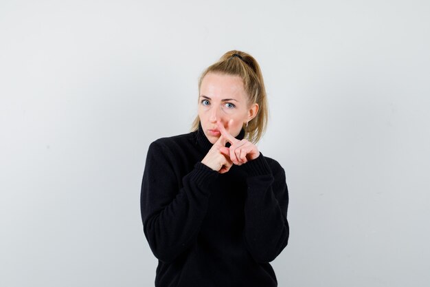 Expressive young woman posing in the studio