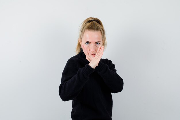 Expressive young woman posing in the studio