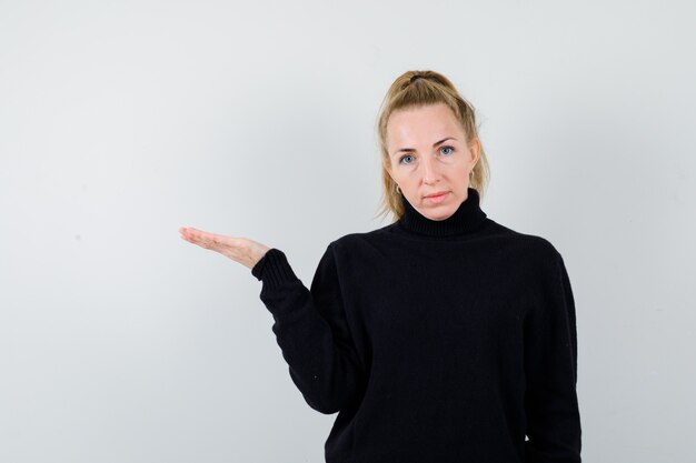 Expressive young woman posing in the studio