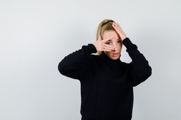 Expressive young woman posing in the studio