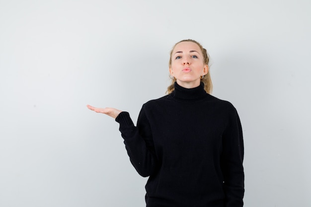 Expressive young woman posing in the studio