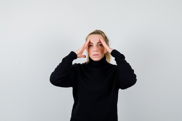 Expressive young woman posing in the studio