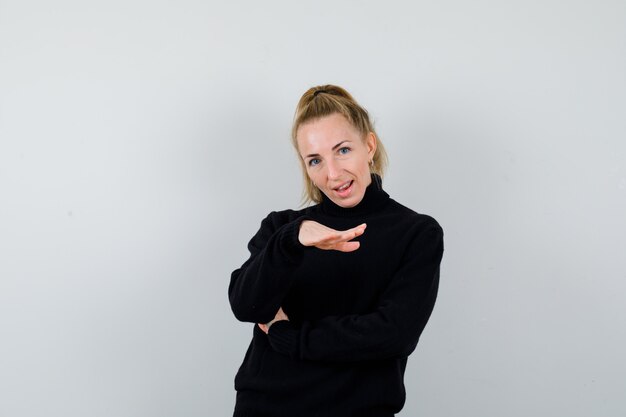 Expressive young woman posing in the studio