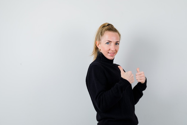 Expressive young woman posing in the studio