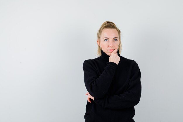 Expressive young woman posing in the studio