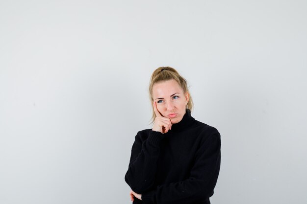 Expressive young woman posing in the studio