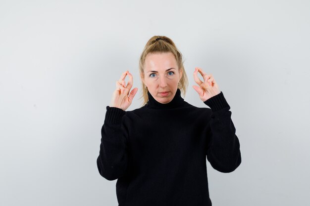 Expressive young woman posing in the studio