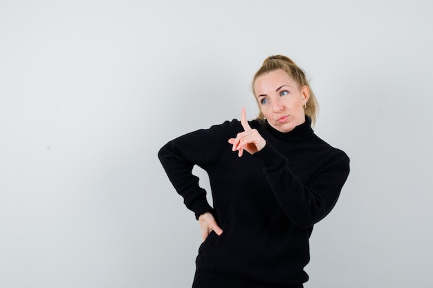 Expressive young woman posing in the studio